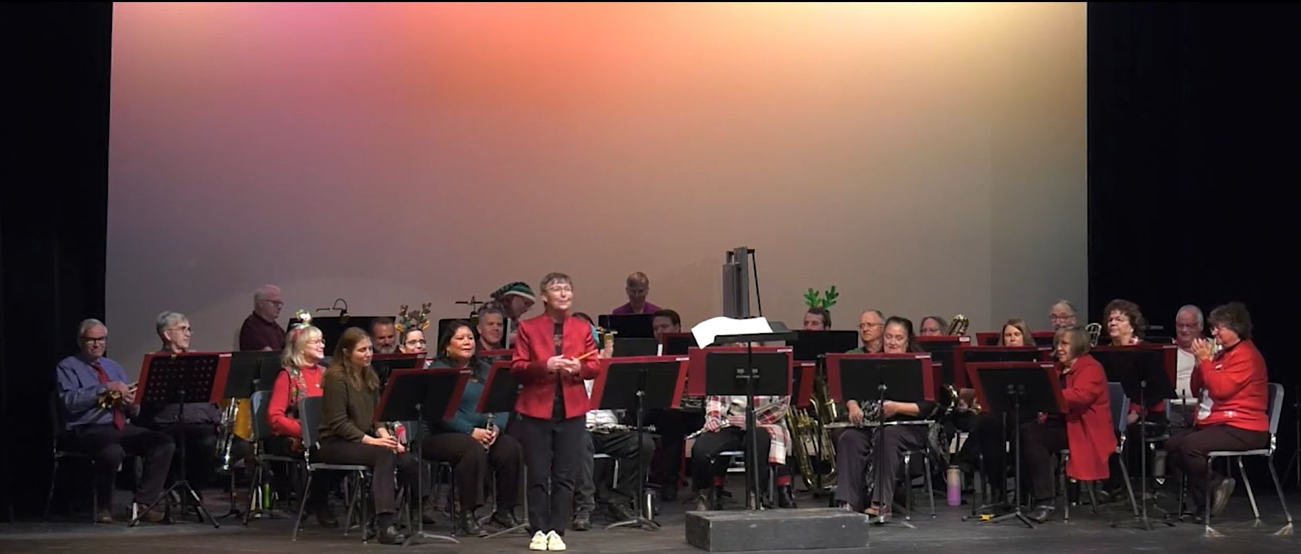 The band performing on a stage